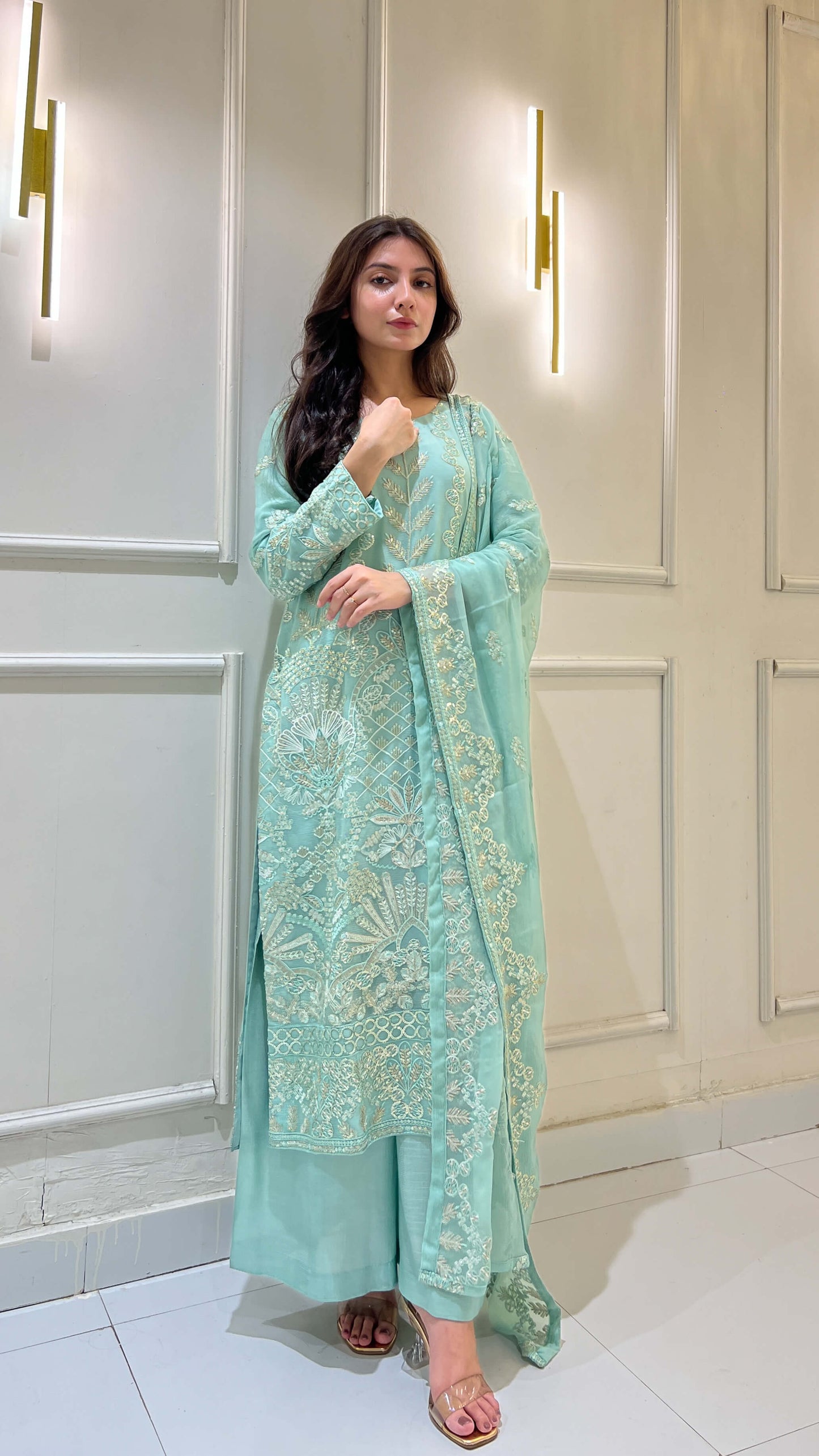 Model styling light blue chiffon embroidered suit with matching dupatta