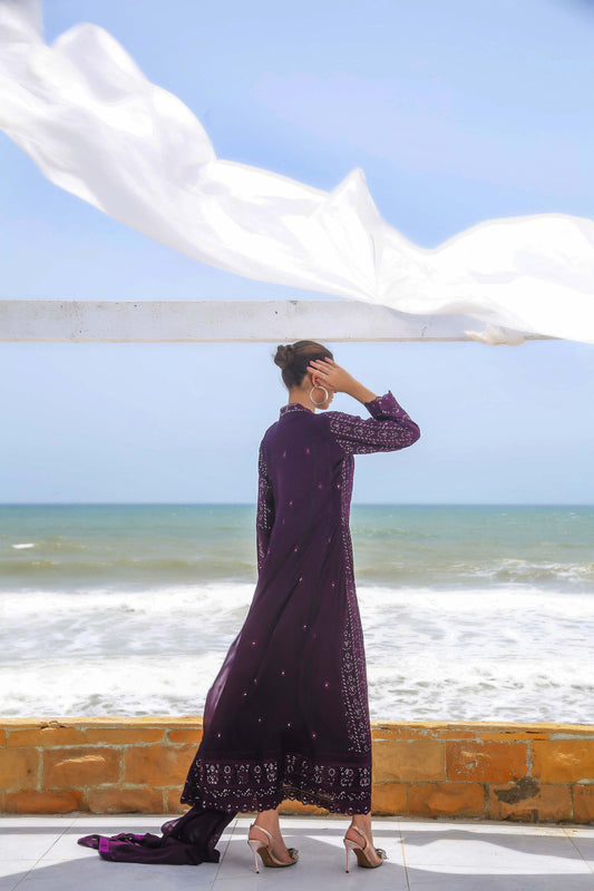 Back view of dark purple embroidered dress