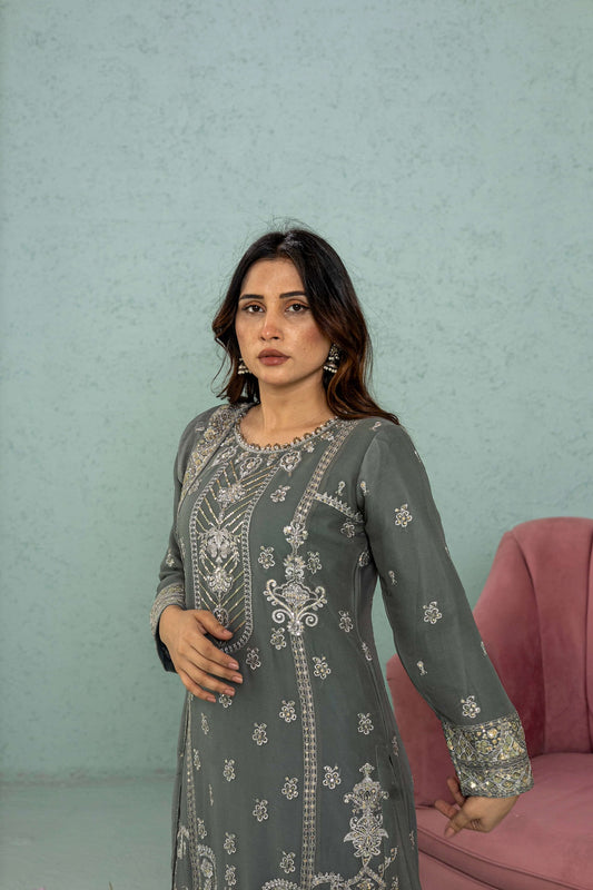 Close-up of embroidery on gray shirt neckline