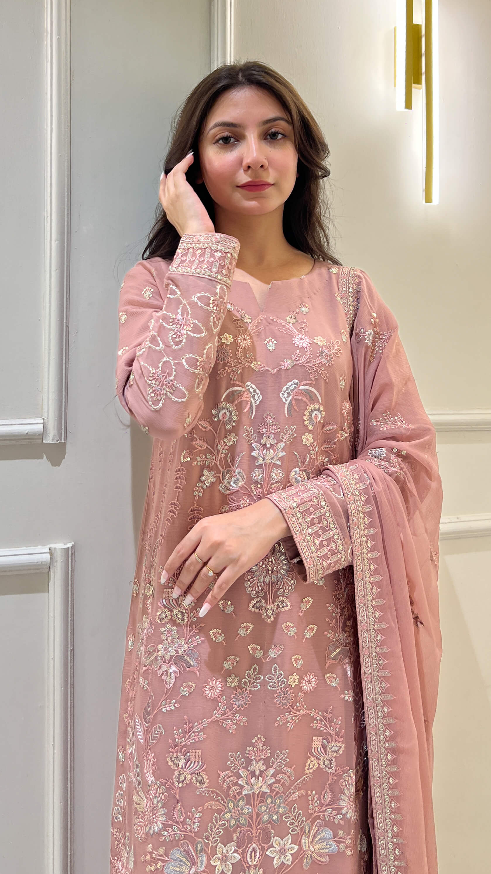 Woman in tea pink embroidered chiffon shalwar kameez with matching dupatta Video